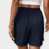 Pantalons Curts Elegants amb Plecs