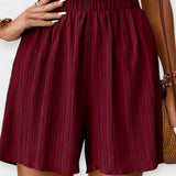 Pantalons Curts Elegants amb Plecs