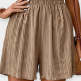 Pantalons Curts Elegants amb Plecs