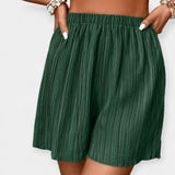 Pantalons Curts Elegants amb Plecs