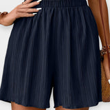 Pantalons Curts Elegants amb Plecs