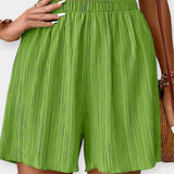 Pantalons Curts Elegants amb Plecs