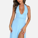 Elegant vestit maxi d'invitada de boda amb coll halter i obertura a la cama