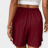 Pantalons Curts Elegants amb Plecs